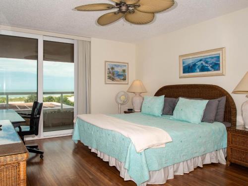 a bedroom with a bed with a view of the ocean at Crescent Beach Club 3B Beachfront Views of the Gulf in Clearwater Beach