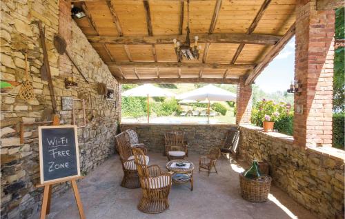 a patio with a table and chairs and a sign at Linda in Cireglio