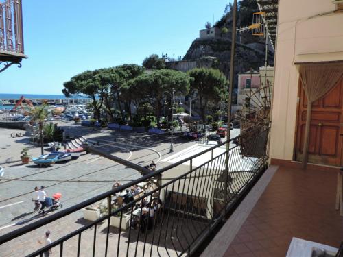 a balcony of a building with a view of the beach at Casa vacanze "Il Baffo e il Mare" in Cetara