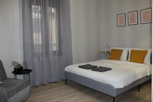 a bedroom with a large bed and a couch at Orange House in the Old Town Plovdiv in Plovdiv