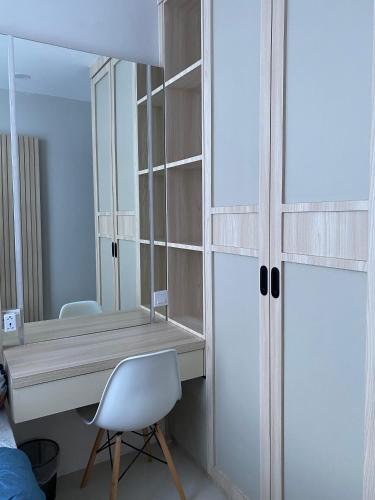 a room with a desk and a mirror and a chair at Formosa Spacious Apartments with Netflix & Pick Up Service by MESA in Nagoya
