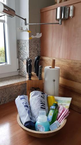 a bowl of toiletries on a table in a kitchen at Ferienhaus Ostseeblick in Wohlenberg
