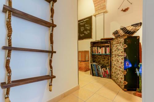 a room with two wooden shelves on the wall at Il Cagliarese B&B in Cagliari