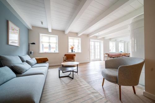 a living room with a couch and a table at Frigga in Nieblum
