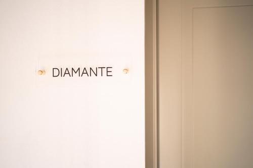 a door with a sign that reads dynamics at Palazzo Scappi Gardi Luxury Apartments in Bologna