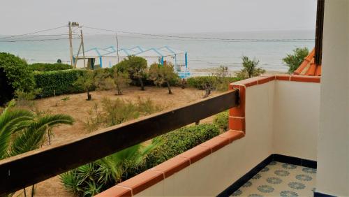 a view of the beach from the balcony of a house at MareDentro in Mazara del Vallo