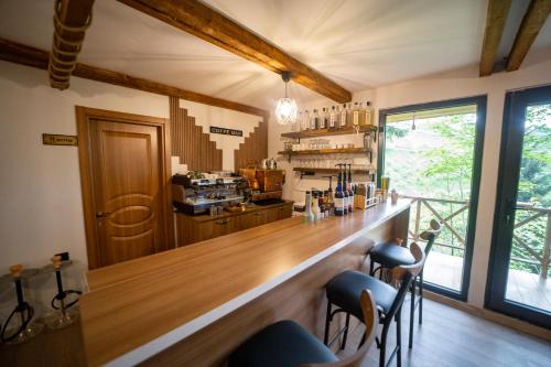 a bar with a counter and chairs in a room at Montana Suite Bungalows in Trabzon