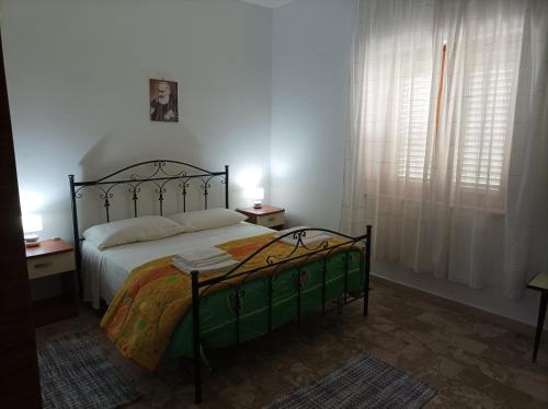 Ένα ή περισσότερα κρεβάτια σε δωμάτιο στο Casa Torrenova