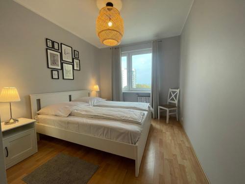 Postel nebo postele na pokoji v ubytování Wolin-Travel Apartament Dom przy Parku
