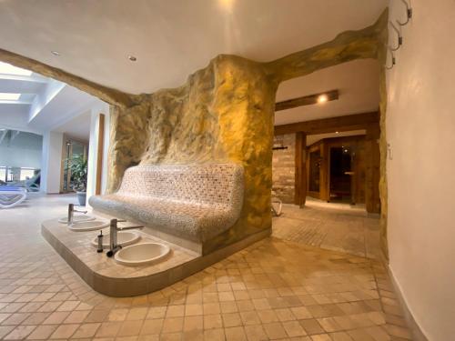 a bathroom with a sink in the middle of a room at Hotel Klosterbräustuben in Zell am Harmersbach