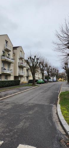 an empty street in front of some buildings at Paris Disney in Collégien