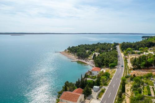 an aerial view of a road next to a body of water at Villa Stjepanovic in Tribanj-Krušćica