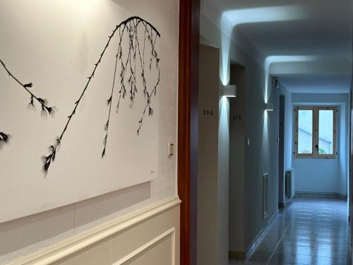 a hallway of a house with a painting on the wall at Hostal Bonavista in Cervera