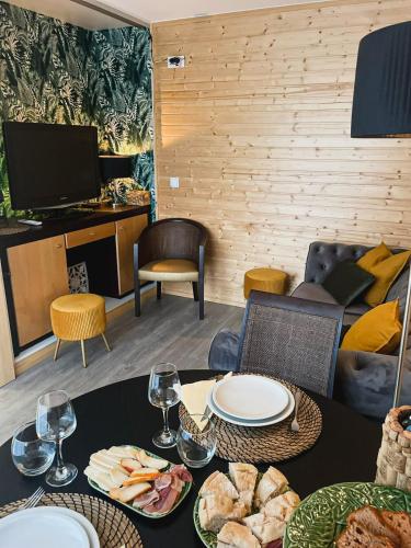 a dining room with a table with plates of food at MOM - Mateus On Modular in Vila Real
