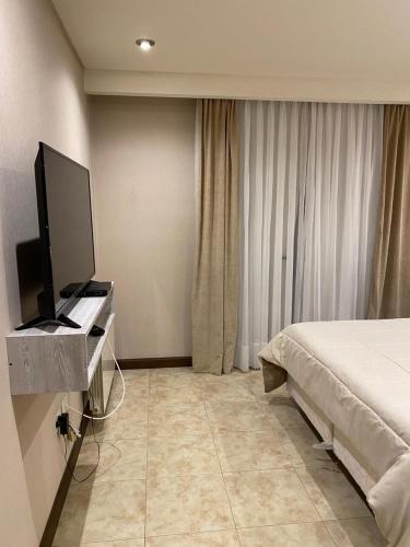 Katil atau katil-katil dalam bilik di Aparts Calafate Suites