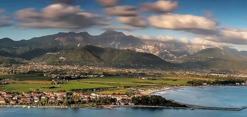 a view of a town with mountains in the background at River Park Hotel in Ameglia