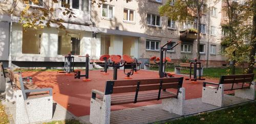 a park with a bunch of playground equipment at Taikos apartment in Klaipėda