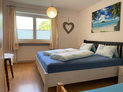 Postel nebo postele na pokoji v ubytování Ferienwohnung Maxi
