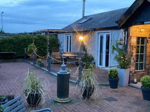 a patio with a fire hydrant in front of a building at Ballybur Lodge Mews 1 in Kilkenny