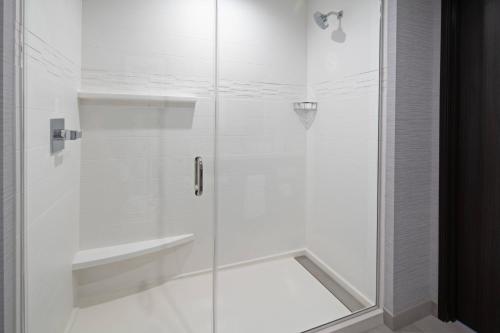 a shower with a glass door in a bathroom at Residence Inn by Marriott Valencia in Valencia