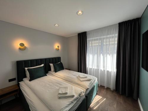 Katil atau katil-katil dalam bilik di Comfort Apartments Palanga