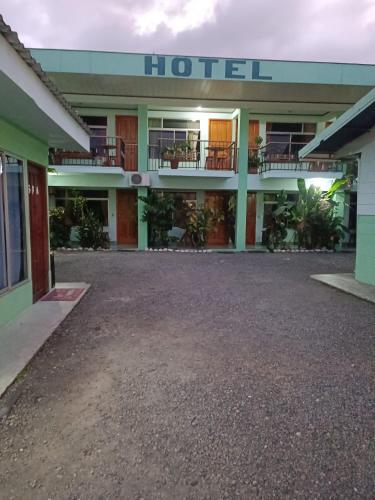 a hotel with a parking lot in front of it at Hotel FAS in Fortuna