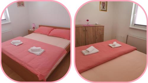 a bedroom with a pink bed and a mirror at Apartmani Apolon in Vrdnik