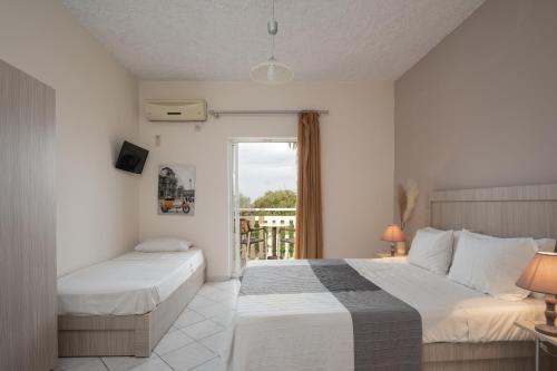 Postel nebo postele na pokoji v ubytování Abelia Boutique Rooms