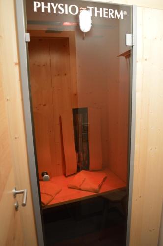 a dressing room with a mirror on a shelf at Landhaus Zum Heidewanderer mit THERMEplus in Bad Bevensen