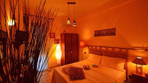 a bedroom with a bed in a room at Terre del Sud in Locri