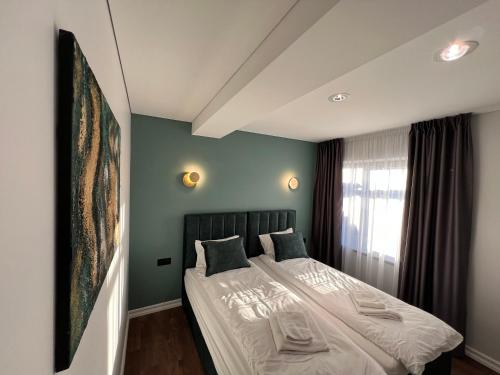 Katil atau katil-katil dalam bilik di Comfort Apartments Palanga