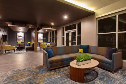 a living room with a couch and a table at Courtyard by Marriott San Diego El Cajon in El Cajon