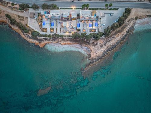 an aerial view of a resort on the beach at Paros Comfy Suites in Naousa