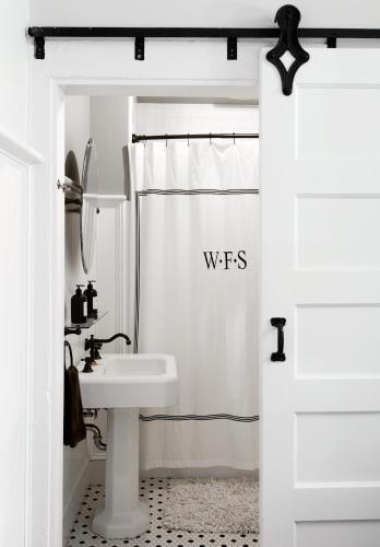 a bathroom with a sink and a shower at Wm. Farmer and Sons in Hudson