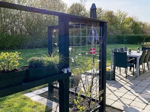 a greenhouse with plants in it in a garden at 6 person holiday home in Sydals-By Traum in Neder Lysabild