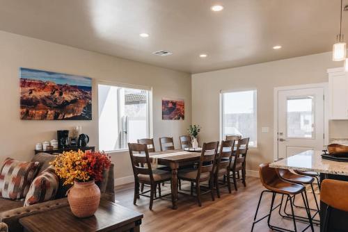 a living room with a table and chairs and a couch at Grand Canyon-4bed,3bath,hot tub in Hildale