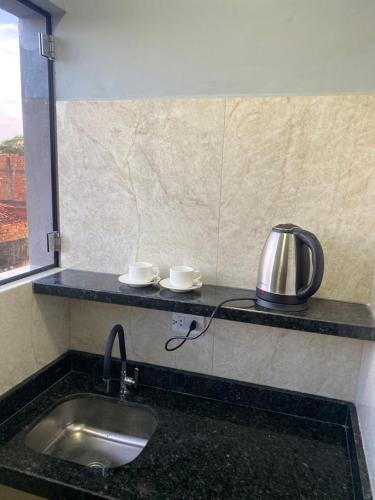 Kuchyň nebo kuchyňský kout v ubytování España Suites Hotel