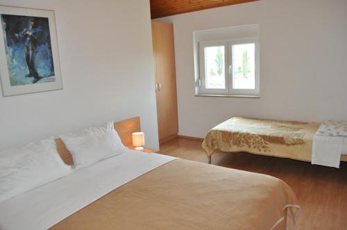 Posteľ alebo postele v izbe v ubytovaní Apartments Smilja