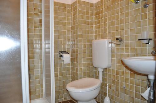 a bathroom with a toilet and a sink at Apartments Smilja in Ljubač