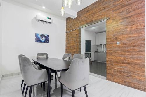 a dining room with a table and chairs at Gorgeous Short-let Apartment Lekki in Lekki