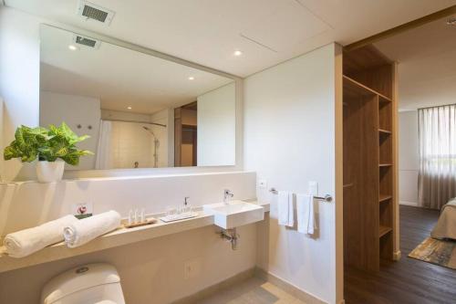 a bathroom with a sink and a mirror at Caluce Apt 2A by Letoh in Chía