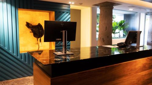 Télévision ou salle de divertissement dans l'établissement Hotel Indigo Guadalajara Expo by IHG