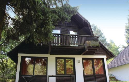 a house with a balcony on top of it at Ferienhaus 22 In Frankenau in Frankenau