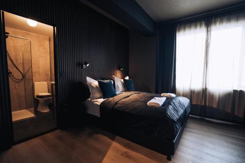 Cama ou camas em um quarto em Brim Hotel