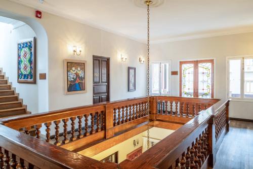 an empty church with a staircase and wooden railing at Hotel Antigua Miraflores in Lima
