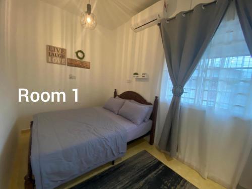 Postel nebo postele na pokoji v ubytování TSJ HOMESTAY