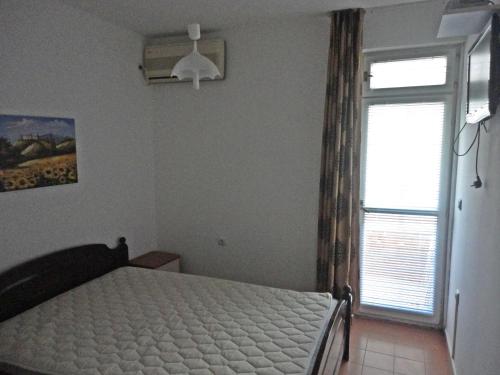 Een bed of bedden in een kamer bij Guest Rooms Casa Luba
