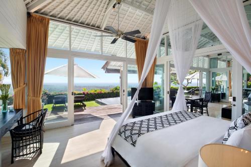 a bedroom with a hammock in a house at Hidden Hills Villas - Small Luxury Hotels of The World in Uluwatu