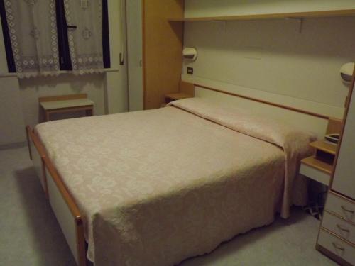 a bedroom with a large bed in a room at Hotel Cristina in Chianciano Terme