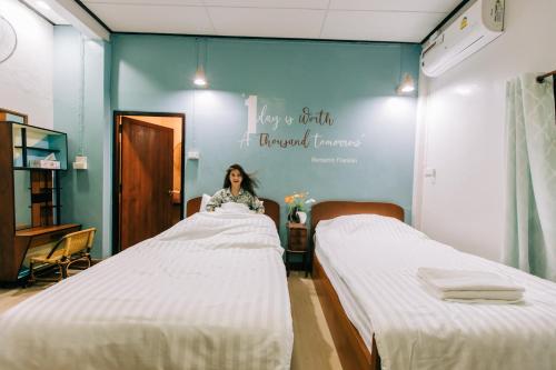 Кровать или кровати в номере Banya BnB ที่พักบ้านย่าบีแอนด์บี เมืองประจวบฯ